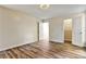 Bedroom featuring hardwood flooring, neutral wall colors, and a closet at 6211 Ward Rd, Union City, GA 30291