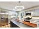 Contemporary kitchen featuring stainless steel appliances and granite countertops at 6211 Ward Rd, Union City, GA 30291
