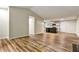 Open-concept living room with laminate floors, connecting to the kitchen at 6211 Ward Rd, Union City, GA 30291