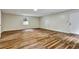 Inviting living room with warm hardwood flooring and plenty of natural light at 6211 Ward Rd, Union City, GA 30291