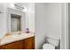 Cozy bathroom showcasing a charming vanity, toilet, and a well-lit mirror at 2323 Wingfoot Pl, Decatur, GA 30035