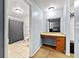 View of an ensuite bathroom with shower-tub, toilet, sink, and vanity featuring a stone countertop at 2323 Wingfoot Pl, Decatur, GA 30035