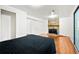 Spacious bedroom features a stone fireplace, access to the backyard, and hardwood flooring at 2323 Wingfoot Pl, Decatur, GA 30035