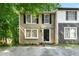 Charming two-story home featuring neutral siding, black shutters, and a welcoming front entrance at 2323 Wingfoot Pl, Decatur, GA 30035