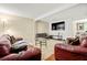 Inviting living room featuring a large screen TV and plush seating area at 2323 Wingfoot Pl, Decatur, GA 30035