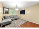 Comfortable sitting room area featuring hardwood floors, light fixture, and natural light at 2323 Wingfoot Pl, Decatur, GA 30035