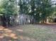 This backyard features a weathered wooden fence, offering privacy and a touch of rustic charm at 33 Drew Ct, Jonesboro, GA 30238