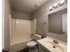 A basic bathroom featuring a sink and a combined tub and shower unit, offering essential functionality at 33 Drew Ct, Jonesboro, GA 30238