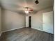 A spacious bedroom with wood-look floors, neutral walls, and a ceiling fan offers a serene retreat at 33 Drew Ct, Jonesboro, GA 30238