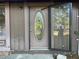 A close up of the front door with oval glass insert and sidelight at 33 Drew Ct, Jonesboro, GA 30238
