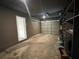 A spacious two-car garage offering ample storage and parking space, featuring built-in shelving units at 33 Drew Ct, Jonesboro, GA 30238