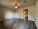 A living room with hardwood floors, a ceiling fan, and neutral paint at 33 Drew Ct, Jonesboro, GA 30238
