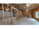 Unfinished basement with exposed framing and concrete floor, offering potential for customization and additional living space at 504 Iris Way, Villa Rica, GA 30180