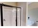 Clean shower enclosure with bathtub next to it in an elegant bathroom at 504 Iris Way, Villa Rica, GA 30180