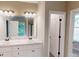 Bathroom features double vanity with marble countertops and plentiful lighting at 504 Iris Way, Villa Rica, GA 30180