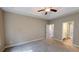 Large bedroom with a tray ceiling, and ensuite bath at 504 Iris Way, Villa Rica, GA 30180