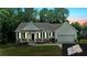 Charming single-story home with white siding, stone accents, well-maintained lawn and attached two car garage at 504 Iris Way, Villa Rica, GA 30180