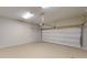 Spacious garage with an automatic door opener, ample lighting, and plenty of room for storage at 504 Iris Way, Villa Rica, GA 30180