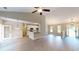 Open concept living room with a breakfast bar that leads to a kitchen with stainless steel appliances at 504 Iris Way, Villa Rica, GA 30180