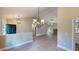 Inviting entry with a modern chandelier and an open layout to the living room with fireplace feature at 504 Iris Way, Villa Rica, GA 30180