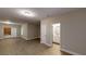 Living room with modern flooring, neutral walls, and ample space, creating a welcoming and versatile living area at 504 Iris Way, Villa Rica, GA 30180