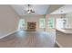 Spacious living room with vaulted ceilings, fireplace, wood floors, and natural light at 504 Iris Way, Villa Rica, GA 30180