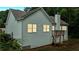 Exterior view of the back of the house showing light gray siding and a small deck with stairs at 504 Iris Way, Villa Rica, GA 30180