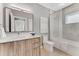 Bright bathroom with a modern vanity, large mirror, and a combined shower and tub at 1099 North Ne Ave # 11, Atlanta, GA 30307