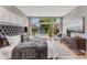 Beautifully furnished main bedroom with large window and a decorative dresser at 1099 North Ne Ave # 11, Atlanta, GA 30307