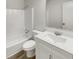 Bright, clean bathroom with a shower-tub combo, sleek vanity, and modern fixtures at 1152 Country Ct, Lawrenceville, GA 30044