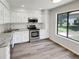 Modern kitchen features stainless steel appliances, granite countertops, and ample cabinet space at 1152 Country Ct, Lawrenceville, GA 30044