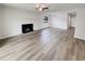 Bright living room with wood flooring, fireplace, and a large window for natural light at 1152 Country Ct, Lawrenceville, GA 30044