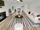 Bright living room boasts a fireplace, light-colored floors, and ample natural light, perfect for relaxing and entertaining at 1152 Country Ct, Lawrenceville, GA 30044