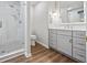 Bathroom with glass shower, neutral paint, modern vanity with drawers and wood flooring at 1416 Vernon Ridge Close, Dunwoody, GA 30338