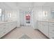 Spacious bathroom with double vanity, tile flooring, and modern lighting fixtures at 1416 Vernon Ridge Close, Dunwoody, GA 30338