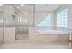 Luxurious bathroom with glass shower and separate soaking tub at 1416 Vernon Ridge Close, Dunwoody, GA 30338