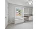 Bedroom with natural light, plush carpet, ceiling fan, built-in shelving and a desk at 1416 Vernon Ridge Close, Dunwoody, GA 30338