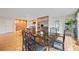 An open-concept area showcases a dining table, hardwood floors, and built-in features in the kitchen at 1416 Vernon Ridge Close, Dunwoody, GA 30338