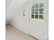 White glass paneled door in a bright room with light-colored tile floor at 1416 Vernon Ridge Close, Dunwoody, GA 30338