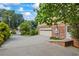 Long concrete driveway leading to a two-car garage at 1416 Vernon Ridge Close, Dunwoody, GA 30338