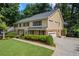 Spacious two-story home with attached garage and well-maintained landscaping at 1416 Vernon Ridge Close, Dunwoody, GA 30338