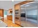 Kitchen with stainless appliances, glass tile backsplash, granite countertop and hardwood floors at 1416 Vernon Ridge Close, Dunwoody, GA 30338