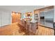 Kitchen with custom wood cabinets, granite countertops, stainless appliances, and breakfast bar seating at 1416 Vernon Ridge Close, Dunwoody, GA 30338