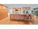 Kitchen with custom wood cabinets, granite countertops, stainless appliances, and breakfast bar seating at 1416 Vernon Ridge Close, Dunwoody, GA 30338