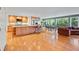 A sprawling kitchen and dining area with hardwood floors, a large island, and an open floor plan at 1416 Vernon Ridge Close, Dunwoody, GA 30338