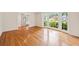 Inviting living room with hardwood floors, large windows, and neutral walls creates a welcoming space at 1416 Vernon Ridge Close, Dunwoody, GA 30338