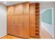 Large pantry with custom wood cabinets and shelving at 1416 Vernon Ridge Close, Dunwoody, GA 30338