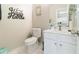 Stylish half-bath with modern fixtures, vanity, and thoughtful decor at 1968 Drennon Ave, Austell, GA 30106