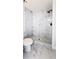 Elegant bathroom with marble tiling, a modern shower, and sleek fixtures, designed for comfort and style at 2027 Lois Pl, Atlanta, GA 30318