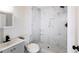 Chic bathroom features a walk-in shower, marble tiling, and contemporary vanity, providing a spa-like experience at 2027 Lois Pl, Atlanta, GA 30318